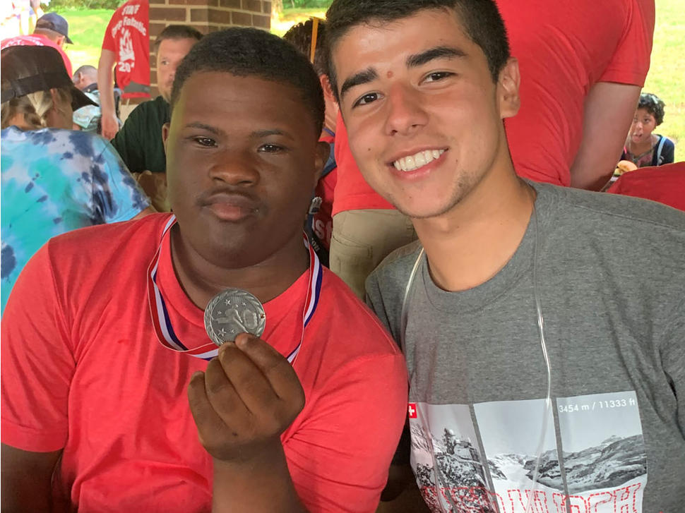 Frank Colon-Matos with camper and his medal at Camp Fantastic 2019