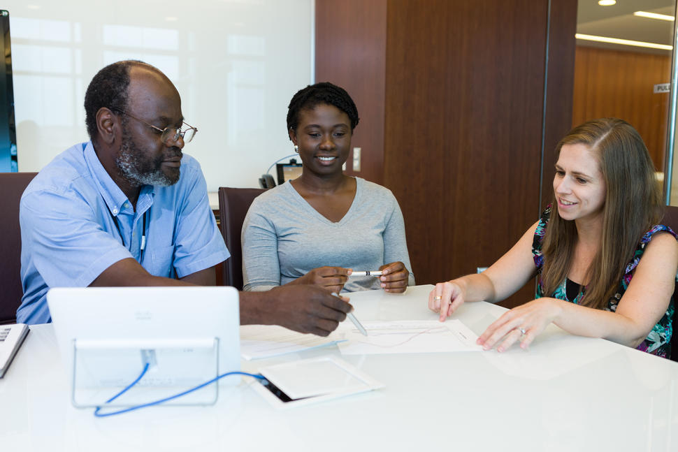 DCEG epidemiologists review data