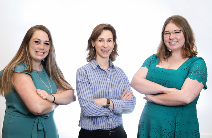 Diane Wigfield, Jackie Lavigne, and Cara Murray in the Office of Education
