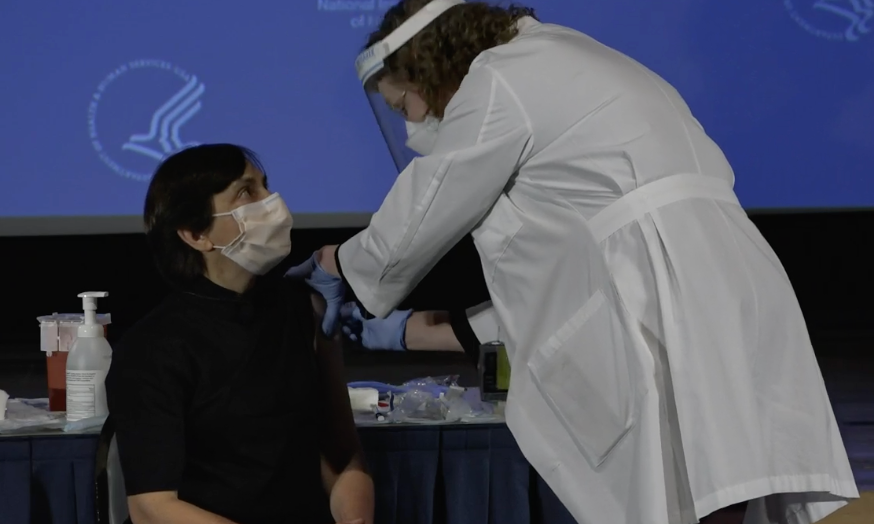 Neelam Giri receives a covid vaccine at the NIH clinical center.