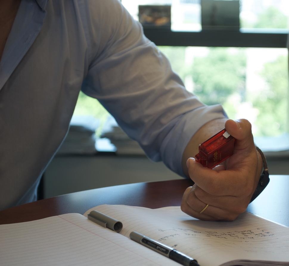 photograph of a man holding an accelerometer
