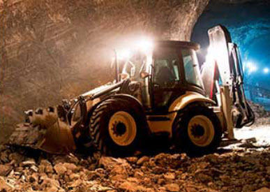 Bulldozer that runs on diesel in a mine.