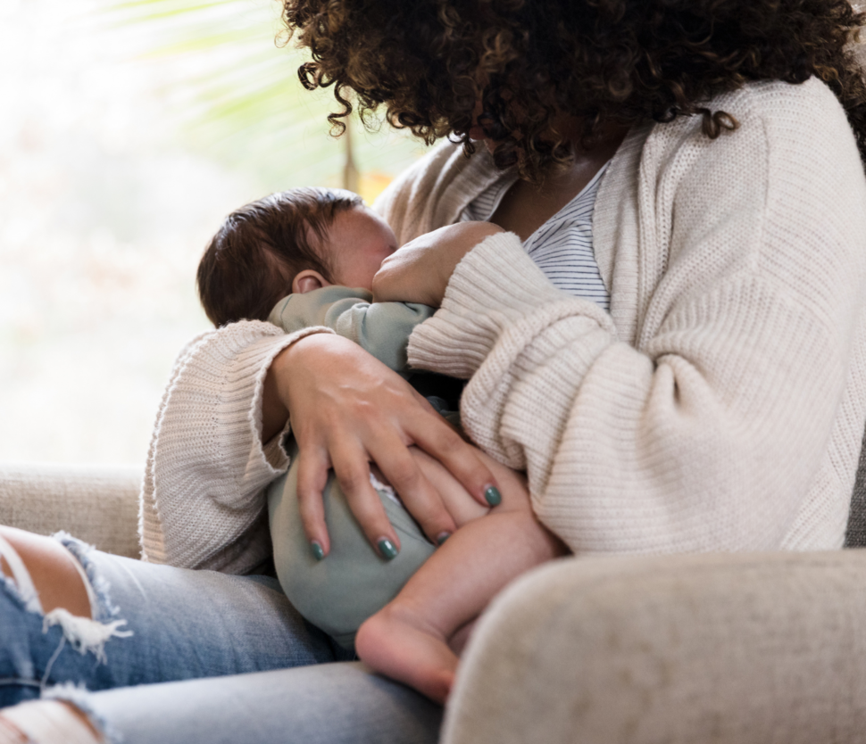 A woman is breastfeeding a baby.