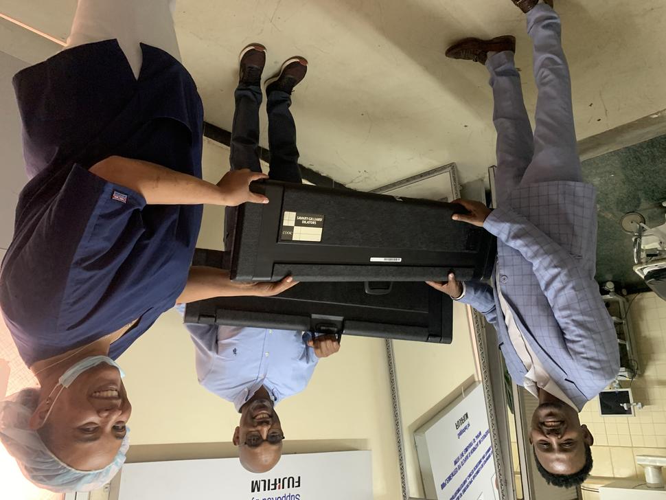 Ethiopian endoscopists receiving esophageal dilator sets.