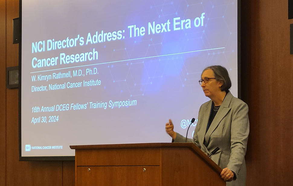 photograph of a woman speaking at podium