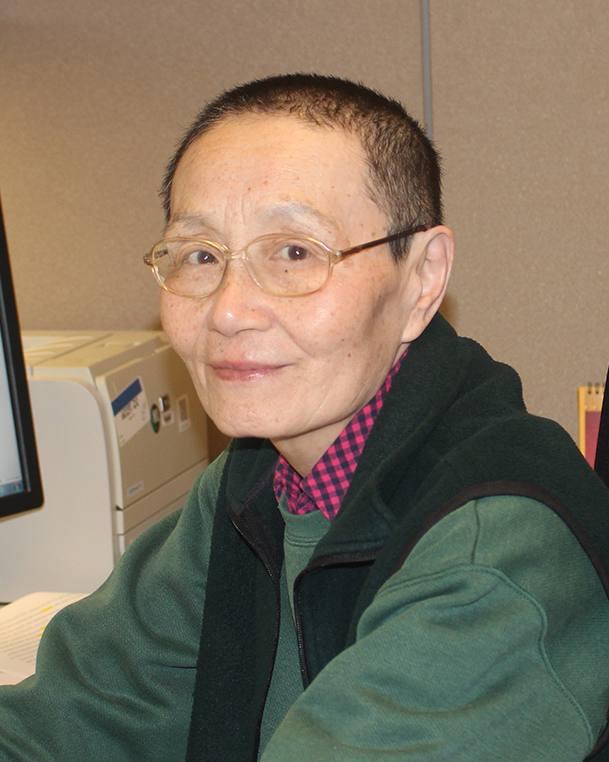 photograph of a woman seated