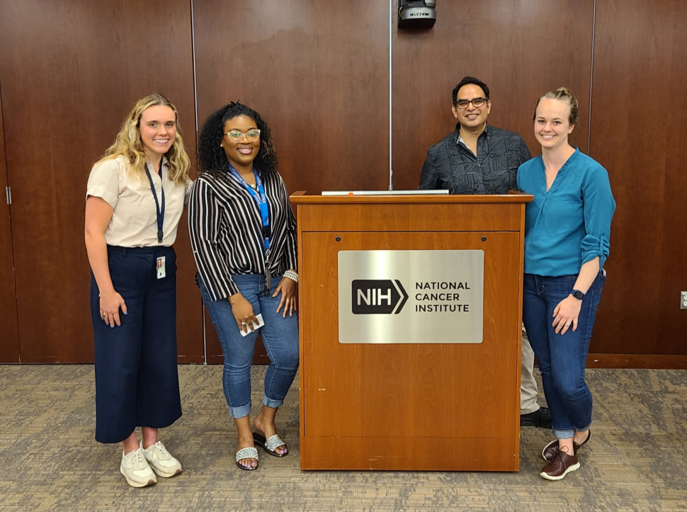 Young Investigator panel speakers gather at podium