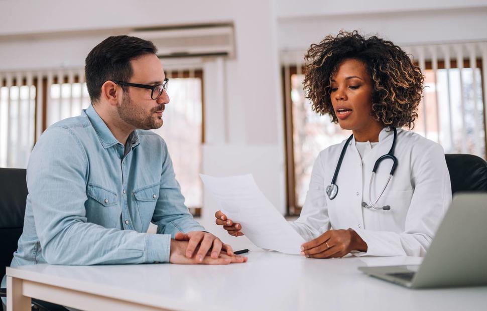 photo of doctor with patient reviewing information