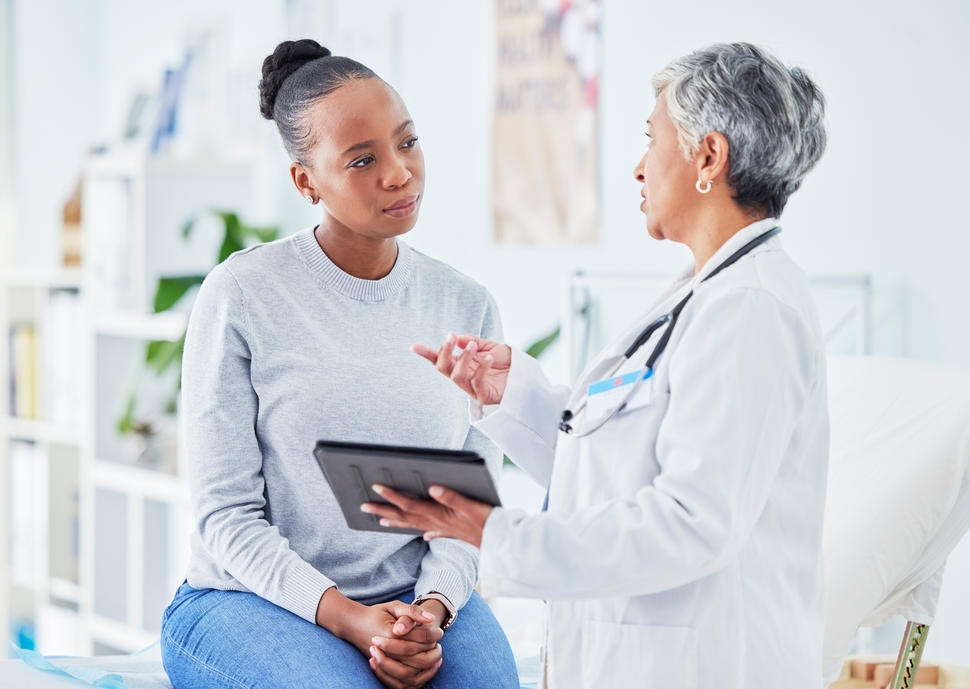 Doctor and woman visit during an appointment. 