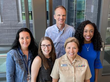 Photo of the RASopathy team standing in a stairwell looking up