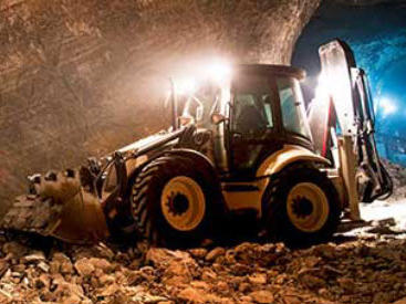 Bulldozer that runs on diesel in a mine.
