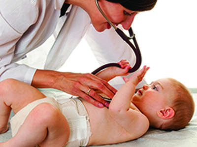Doctor examining baby