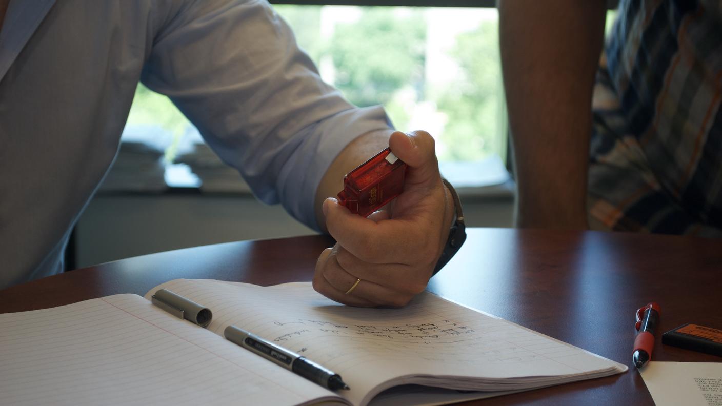 photograph of a man holding an accelerometer