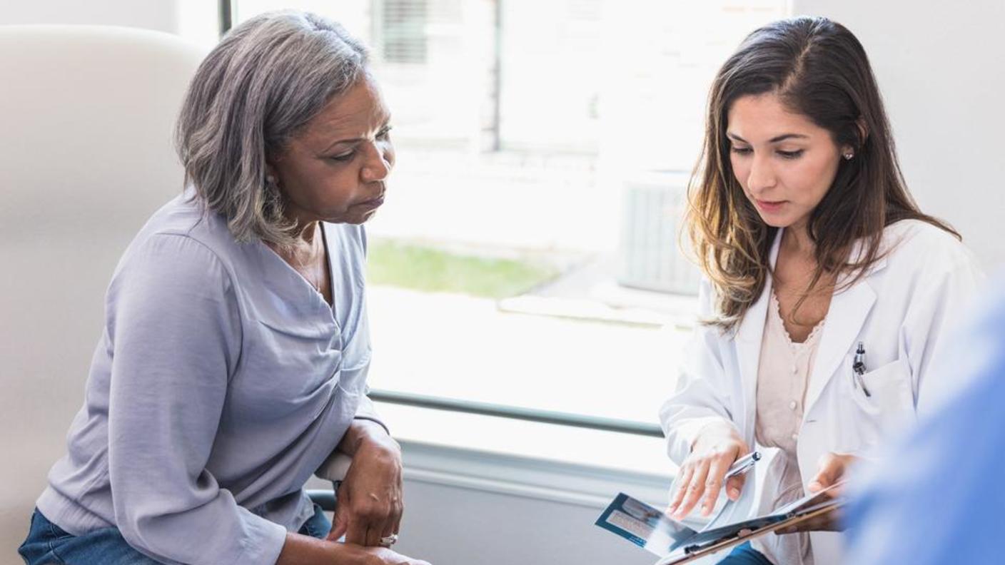 photograph of older woman with doctor