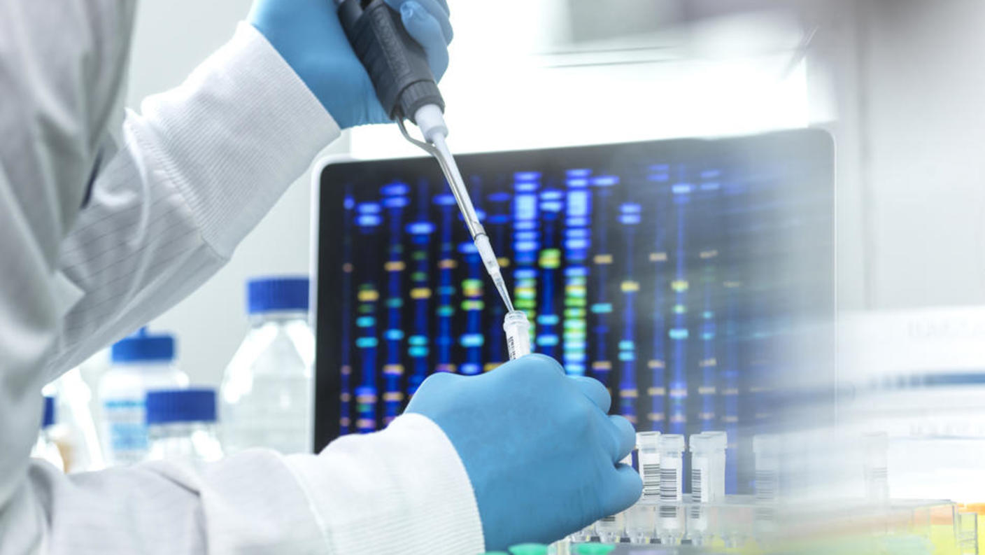 Researcher pipetting DNA samples.