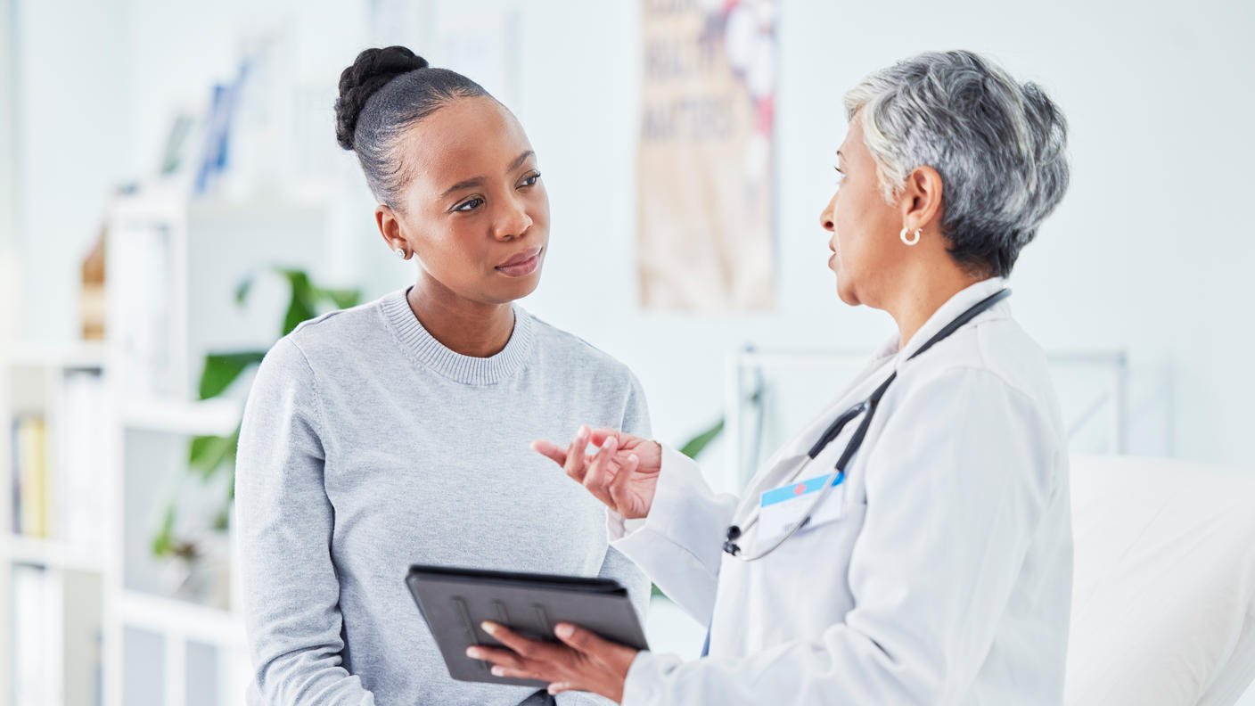Doctor and woman visit during an appointment. 