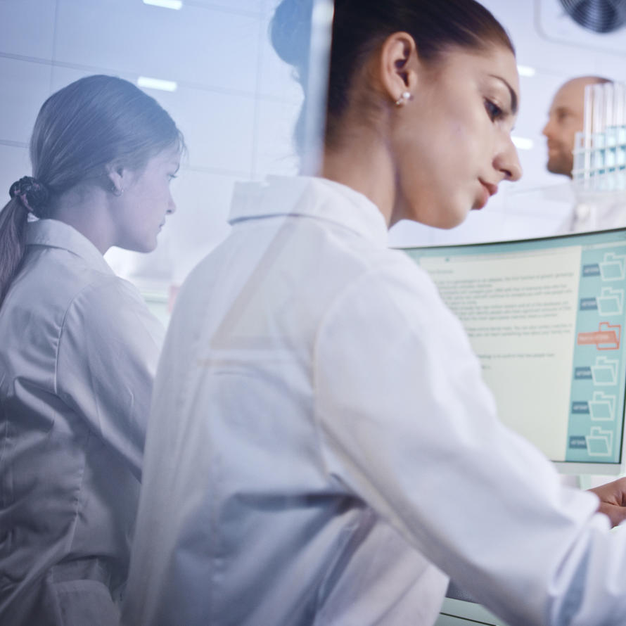  Two women research team studying DNA mutations.