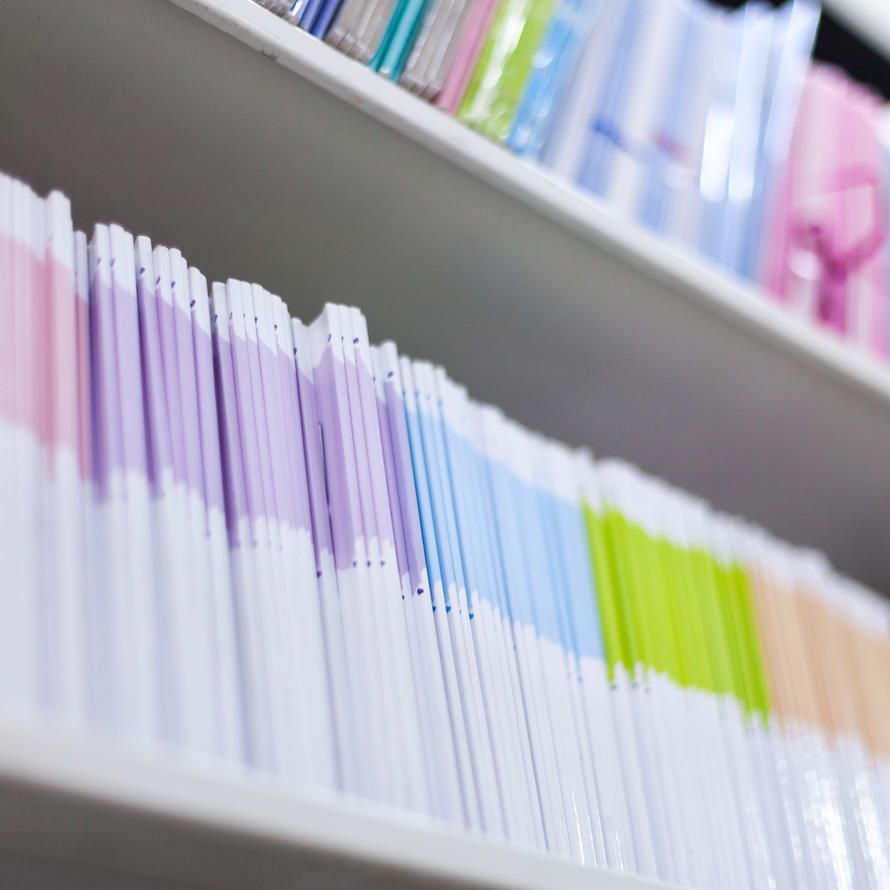 Multiple journals on a shelf. 