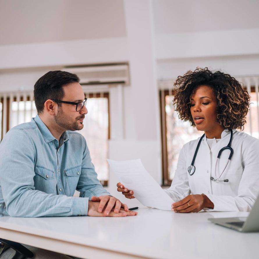 photo of doctor with patient reviewing information