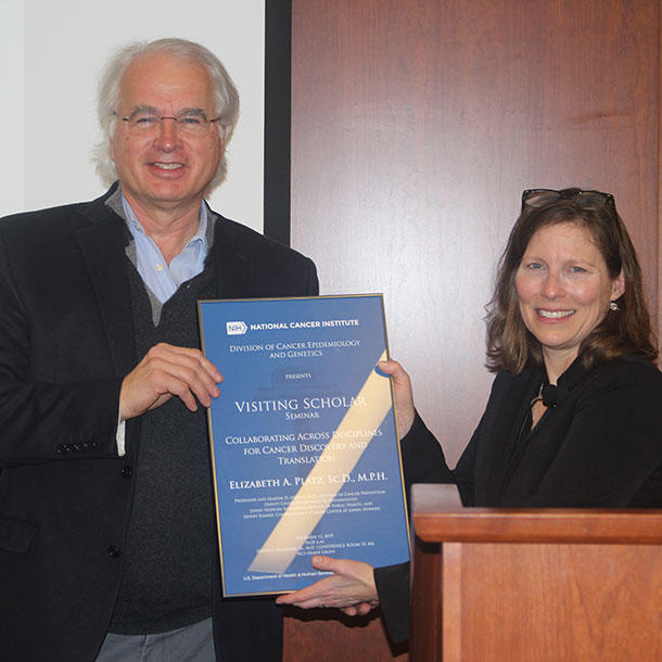 Stephen Chanock presents Elizabeth Platz with Visiting Scholar plaque