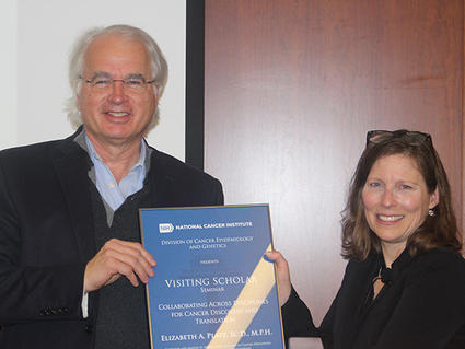 Stephen Chanock presents Elizabeth Platz with Visiting Scholar plaque