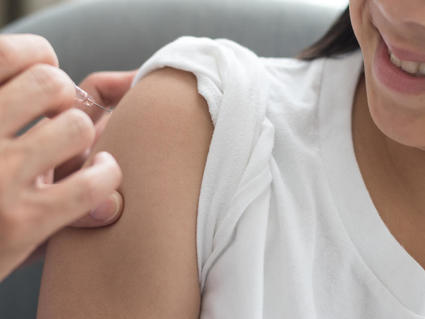 Image of a girl being vaccinated.