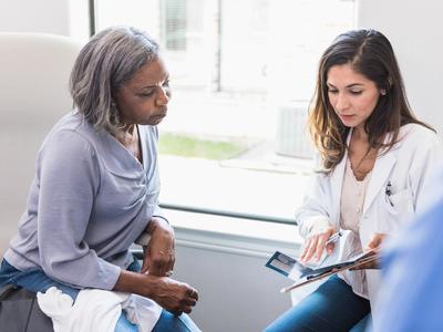 photograph of older woman with doctor
