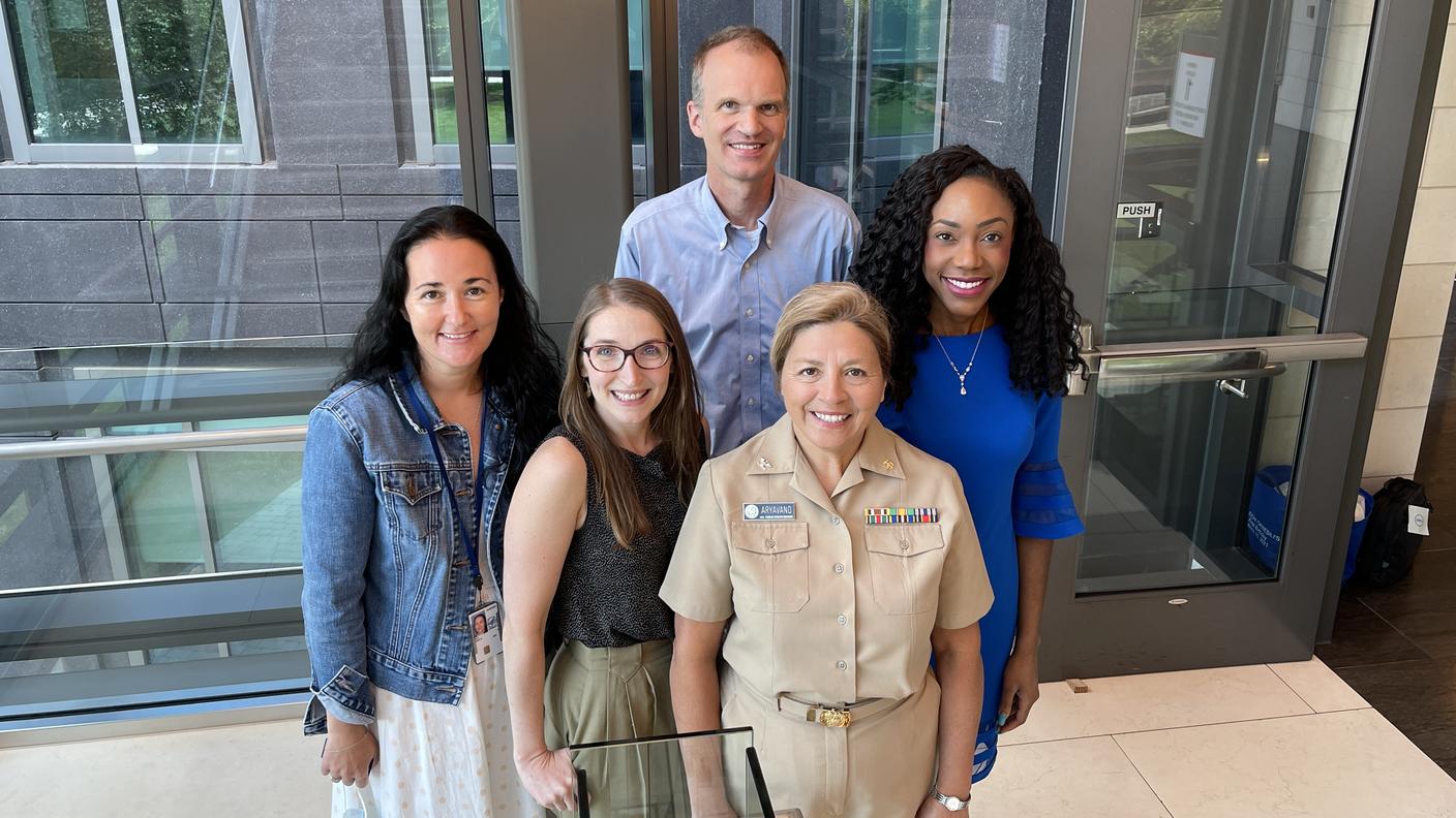Photo of the RASopathy team standing in a stairwell looking up
